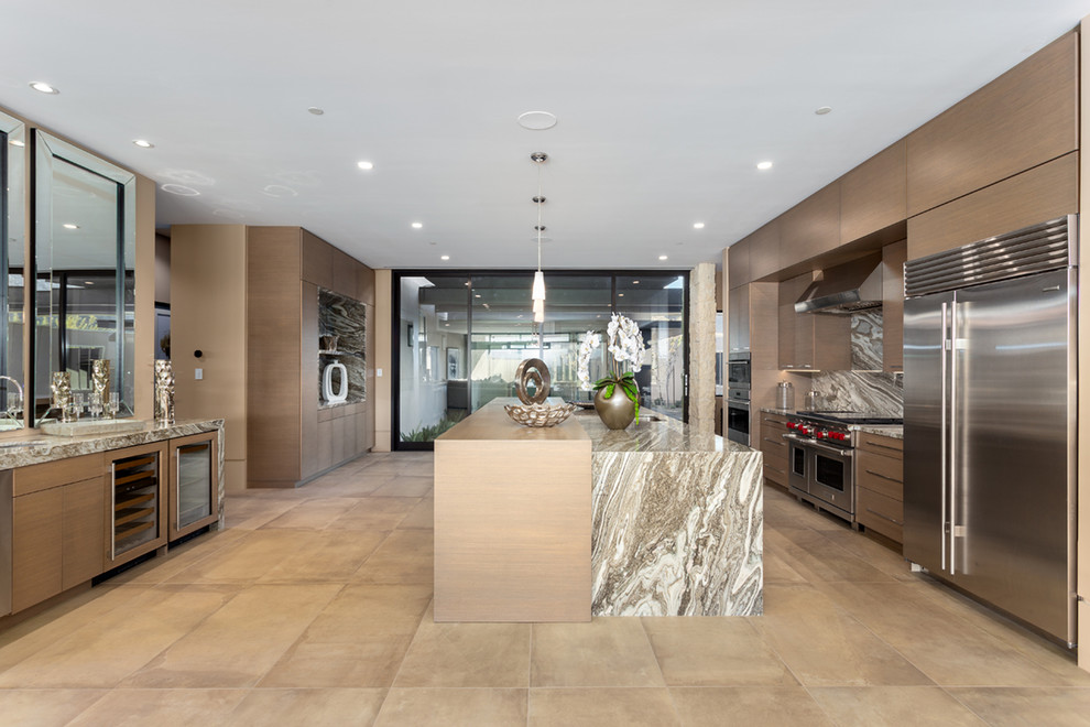 This is an example of a contemporary kitchen in Phoenix with flat-panel cabinets, medium wood cabinets, multi-coloured splashback, stone slab splashback, stainless steel appliances, with island, beige floor and multi-coloured benchtop.