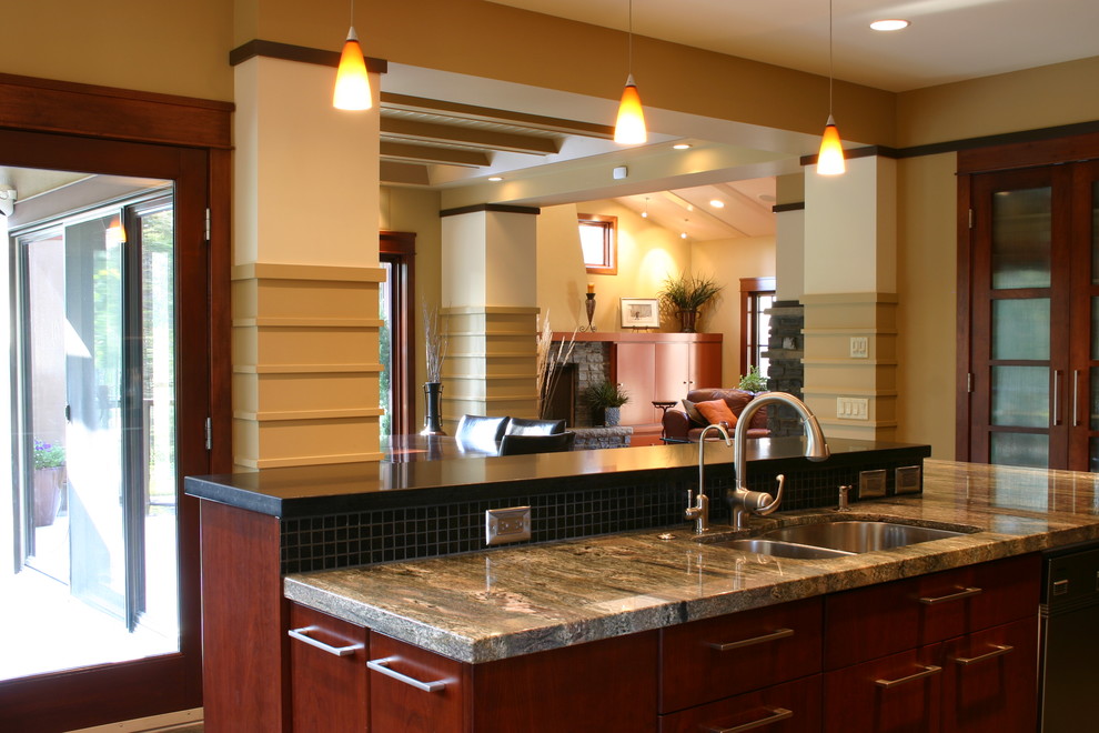 Eat-in kitchen - mid-sized transitional u-shaped ceramic tile and beige floor eat-in kitchen idea in Calgary with a double-bowl sink, flat-panel cabinets, dark wood cabinets, granite countertops, black backsplash, mosaic tile backsplash, stainless steel appliances and an island