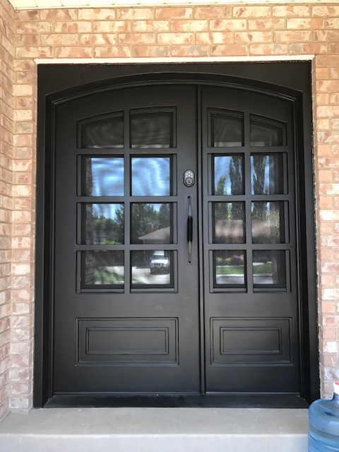 Mid-sized arts and crafts front door in Salt Lake City with beige walls, a double front door and a black front door.