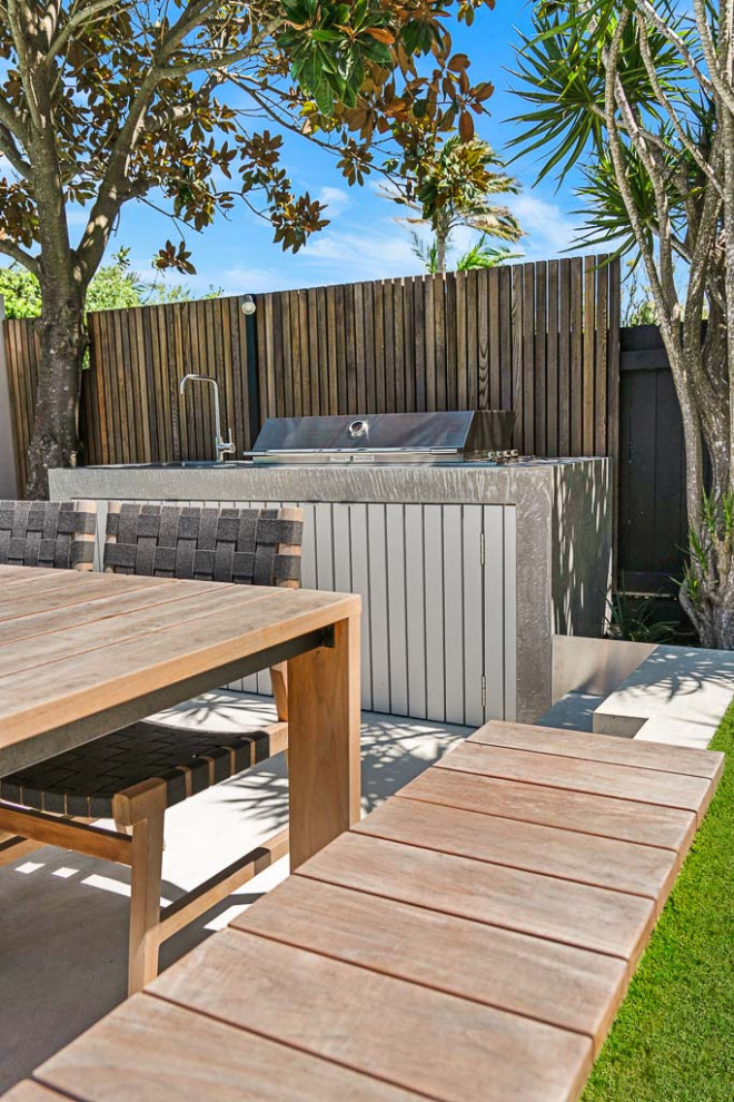 Patio kitchen - mid-sized contemporary backyard concrete paver patio kitchen idea in Sydney with no cover