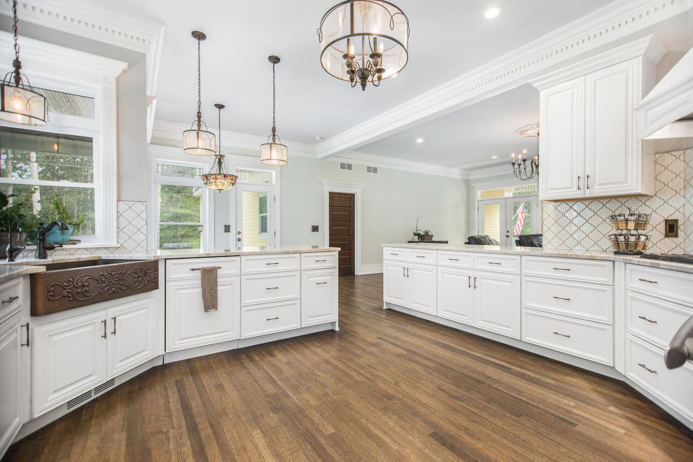 Traditional eat-in kitchen in Grand Rapids with white cabinets and granite benchtops.