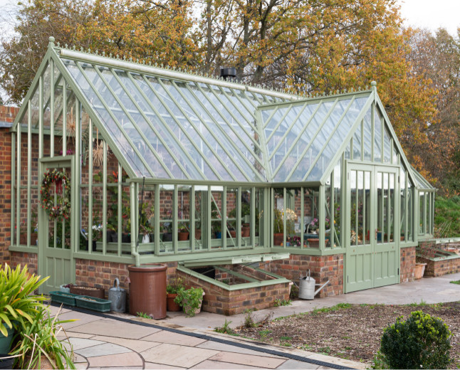 This is an example of a large victorian attached greenhouse in Other.