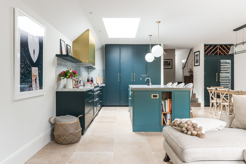 Large traditional l-shaped open plan kitchen in London with an integrated sink, flat-panel cabinets, blue cabinets, concrete worktops, grey splashback, marble splashback, stainless steel appliances, cement flooring, an island and beige floors.