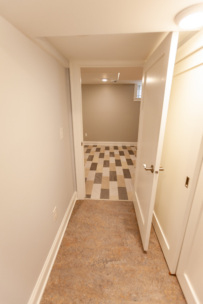 Transitional hallway in Minneapolis with grey walls, linoleum floors and beige floor.