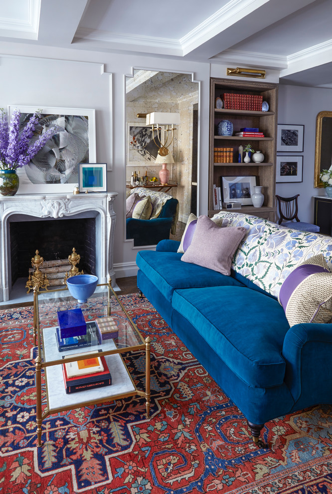 Photo of a small traditional open concept living room in New York with a home bar, grey walls, dark hardwood floors, a standard fireplace, a stone fireplace surround and a wall-mounted tv.