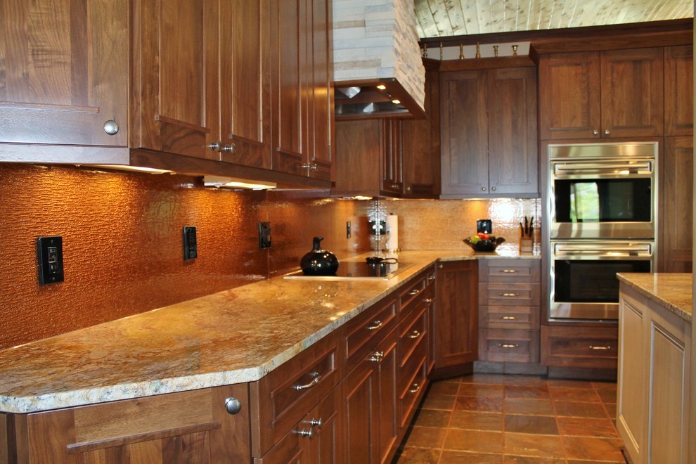 Huge transitional l-shaped slate floor open concept kitchen photo in Denver with an undermount sink, flat-panel cabinets, dark wood cabinets, granite countertops, brown backsplash, glass tile backsplash, stainless steel appliances and an island