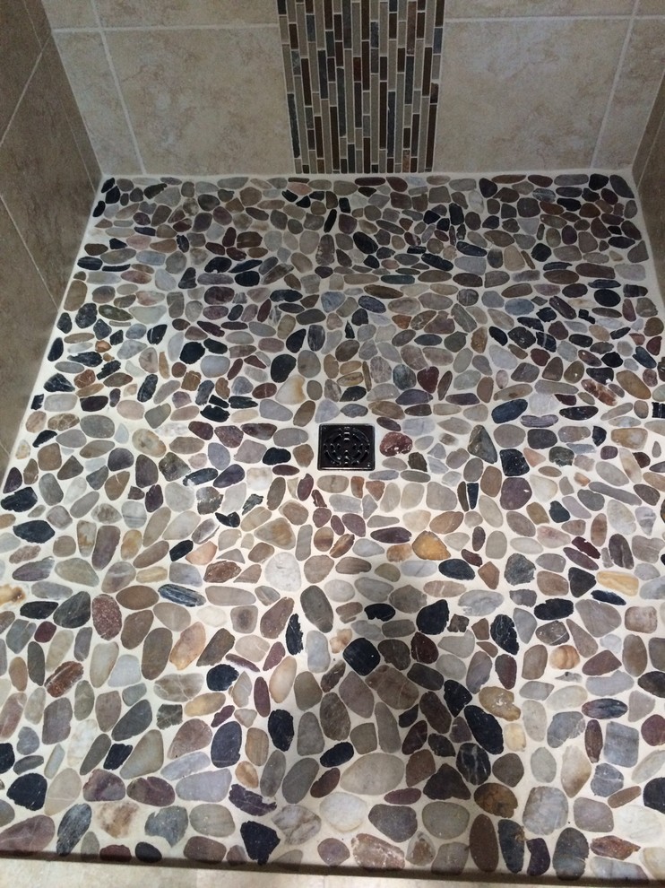 Inspiration for a mid-sized contemporary bathroom in Sacramento with a two-piece toilet, multi-coloured tile, pebble tile, beige walls and pebble tile floors.