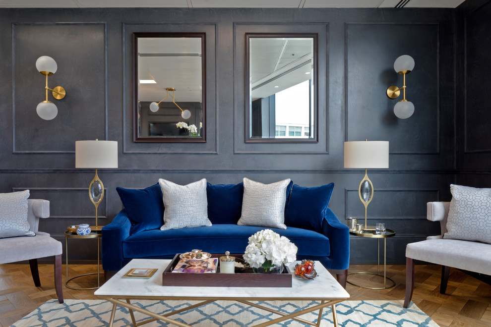 Inspiration for a transitional formal living room in London with blue walls and medium hardwood floors.