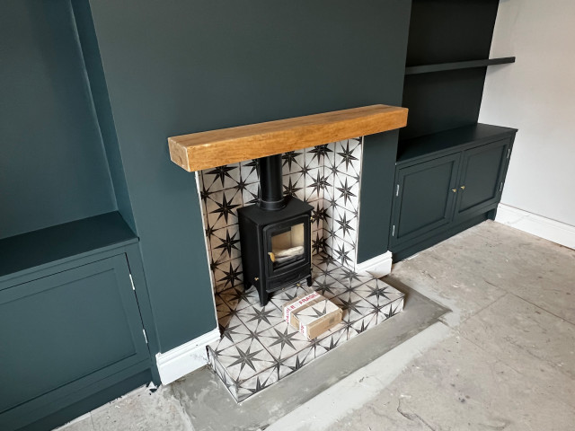 Feature log burner, tiled hearth and wooden mantelpiece AFTER modern-living-room