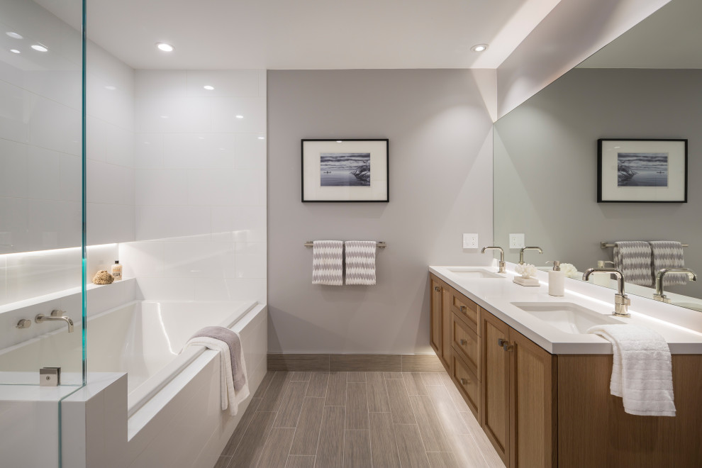 Inspiration for a large transitional master bathroom in San Francisco with shaker cabinets, medium wood cabinets, a drop-in tub, white tile, ceramic tile, grey walls, wood-look tile, an undermount sink, engineered quartz benchtops, beige floor, white benchtops, a niche, a double vanity and a floating vanity.