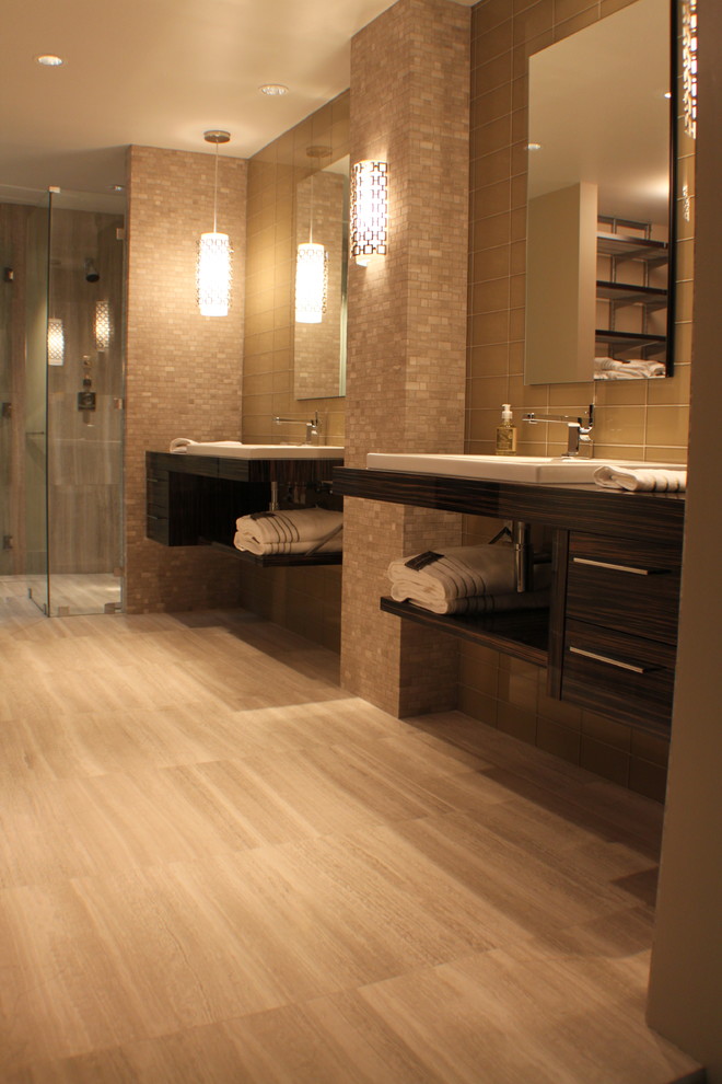 Photo of a large contemporary master bathroom in Atlanta with brown cabinets, porcelain floors, grey floor, flat-panel cabinets, an alcove shower, grey walls, a vessel sink, wood benchtops, a hinged shower door, travertine and beige tile.