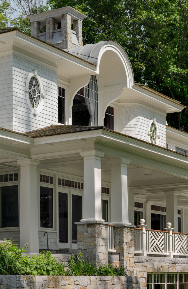 This is an example of a coastal porch design in Boston.