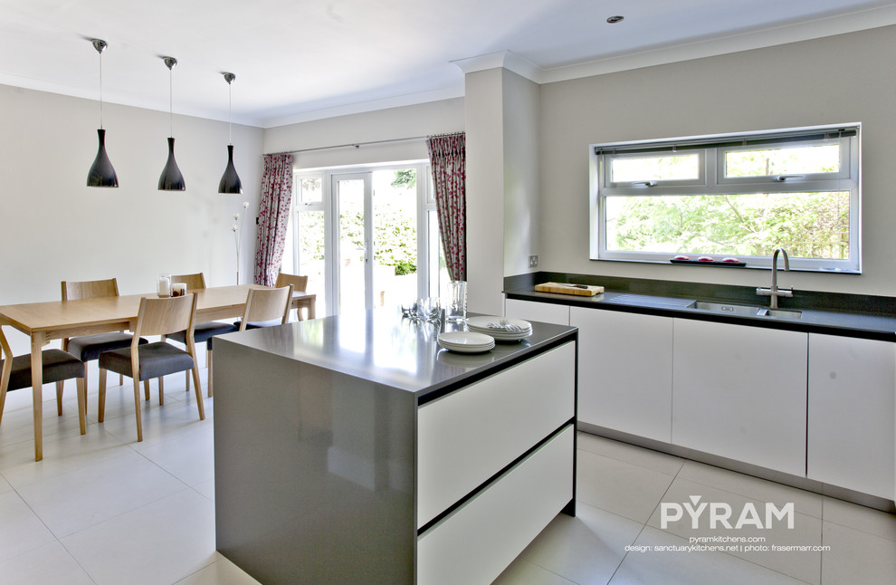 This is an example of a contemporary kitchen in Surrey.