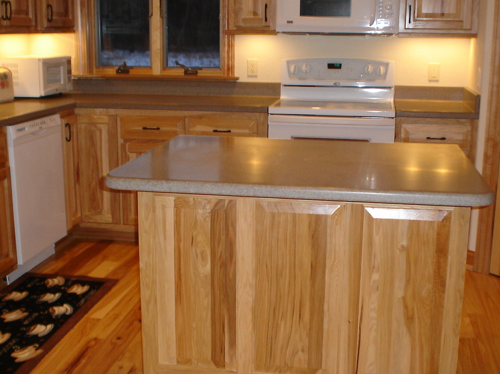 Kitchen - kitchen idea in Milwaukee with raised-panel cabinets and laminate countertops