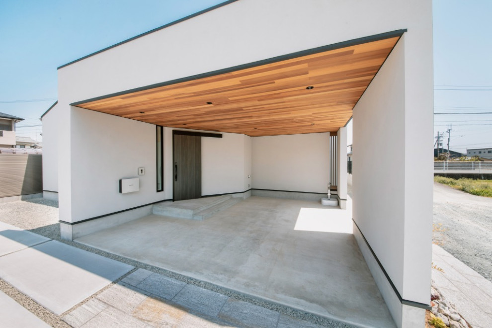 Carport - contemporary attached one-car carport idea in Other