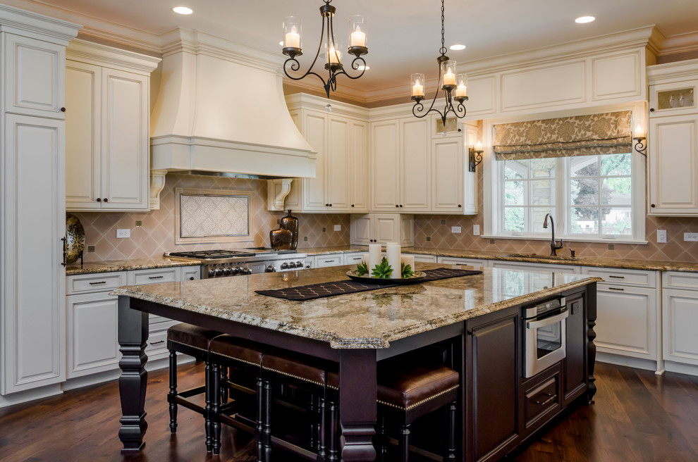 Large transitional galley medium tone wood floor eat-in kitchen photo in Chicago with a drop-in sink, beaded inset cabinets, white cabinets, marble countertops, white backsplash, ceramic backsplash and an island