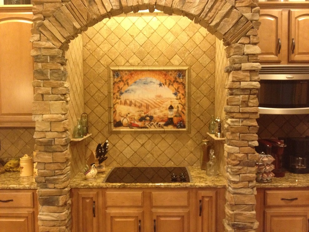 Light wood floor eat-in kitchen photo with light wood cabinets, granite countertops and beige backsplash