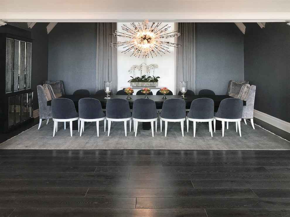 This is an example of a large contemporary open plan dining in Chicago with dark hardwood floors, black floor and vaulted.