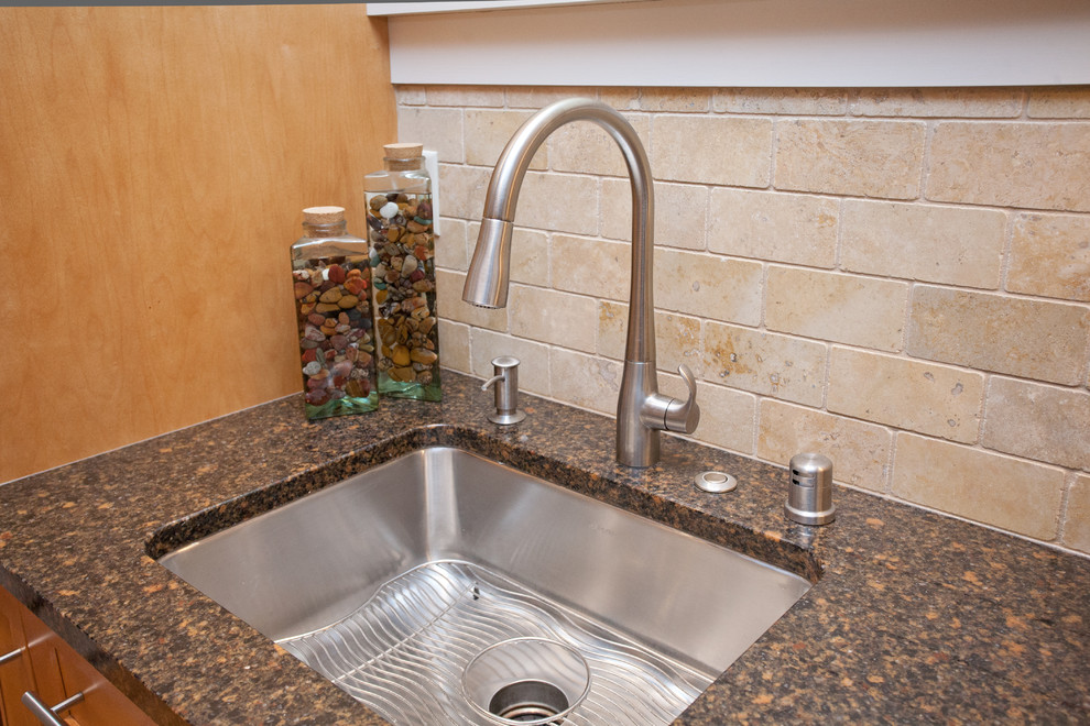 Example of a small transitional galley medium tone wood floor eat-in kitchen design with an undermount sink, recessed-panel cabinets, light wood cabinets, quartz countertops, beige backsplash, stone tile backsplash, white appliances, beige walls and no island