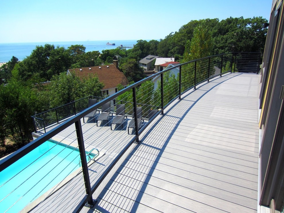 Trendy backyard balcony deck photo with no cover