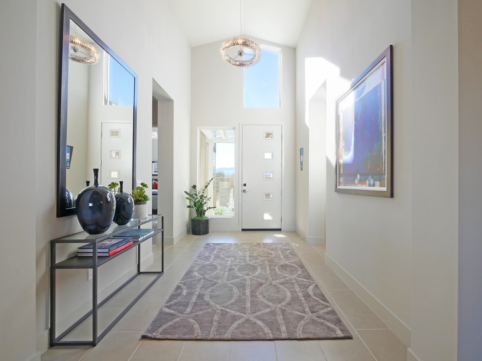 Mid-sized contemporary foyer in Los Angeles with beige walls, ceramic floors, a single front door and a white front door.