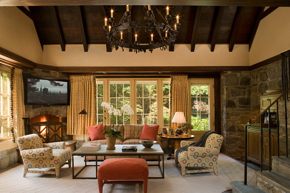 Inspiration for a traditional family room in New York with a corner fireplace and a stone fireplace surround.