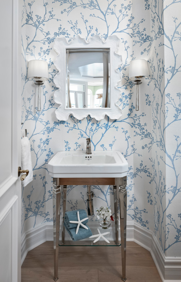 Bathroom - mid-sized transitional light wood floor, beige floor, single-sink and wallpaper bathroom idea with multicolored walls, an integrated sink, solid surface countertops and white countertops