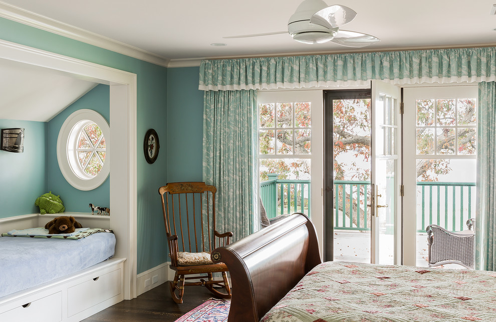 Inspiration for a traditional bedroom in Boston with blue walls and dark hardwood floors.