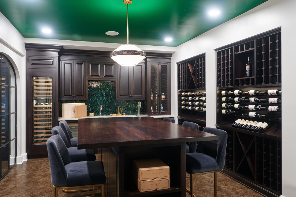 Inspiration for a large traditional wine cellar in Cleveland with dark hardwood floors, storage racks and brown floor.
