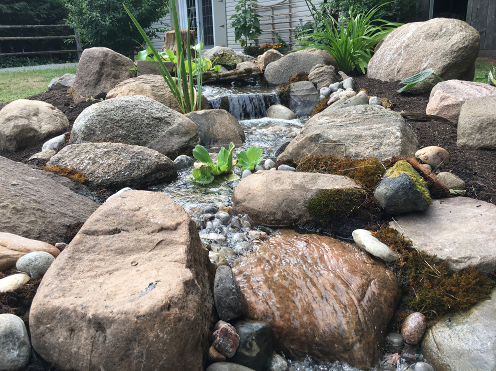Inspiration for a mid-sized rustic backyard landscaping for fall.