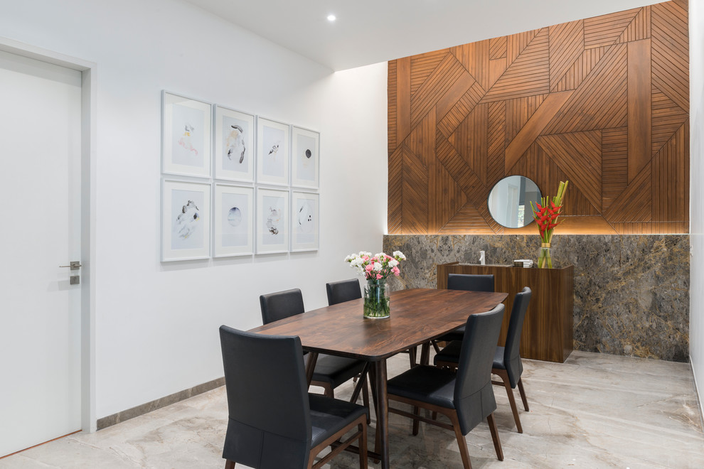 This is an example of a contemporary dining room in Other with white walls and grey floor.