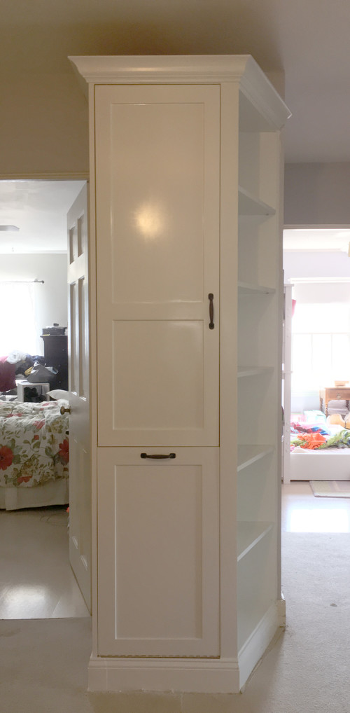 Salvaged laundry chute with custom cabinet design