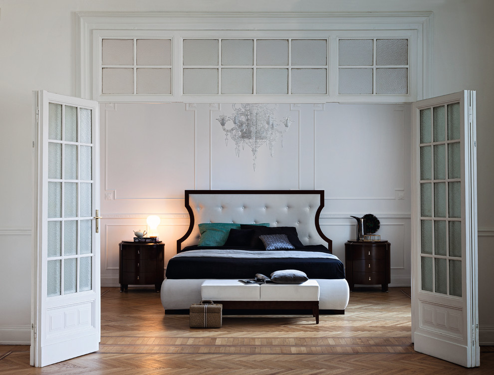 Inspiration for a large transitional bedroom in Cheshire with white walls and light hardwood floors.