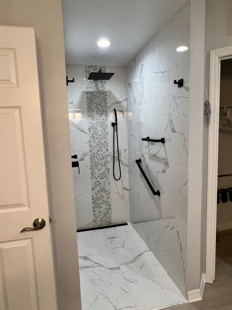 Photo of a medium sized contemporary ensuite bathroom in Orlando with flat-panel cabinets, white cabinets, a built-in bath, a built-in shower, a one-piece toilet, white tiles, porcelain tiles, grey walls, porcelain flooring, a submerged sink, engineered stone worktops, white floors, an open shower, white worktops, a wall niche, double sinks and a floating vanity unit.