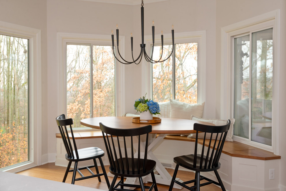 Inspiration for a large transitional medium tone wood floor and exposed beam kitchen/dining room combo remodel with white backsplash, stainless steel appliances and an island