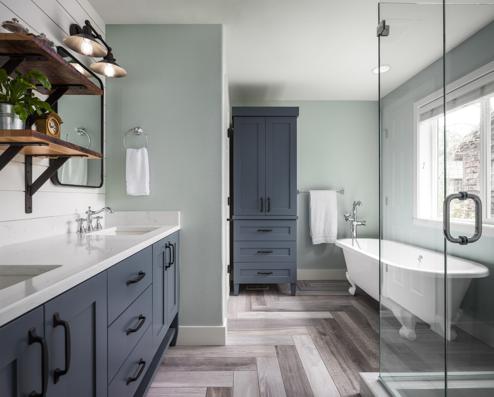 Inspiration for a mid-sized country master bathroom in Portland with shaker cabinets, grey cabinets, a claw-foot tub, a corner shower, an undermount sink, engineered quartz benchtops, grey floor, a hinged shower door and green walls.