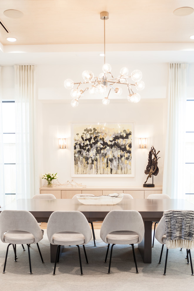 Design ideas for a transitional dining room in Houston with white walls.