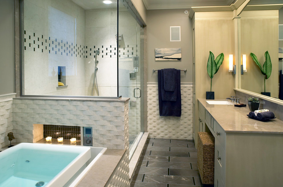 Inspiration for a mid-sized transitional master gray tile alcove shower remodel with gray walls, beaded inset cabinets, beige cabinets, an undermount tub and an undermount sink