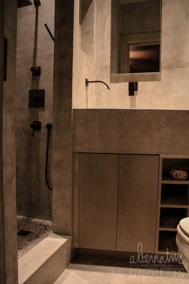 Photo of a modern bathroom in Miami with a trough sink and concrete benchtops.