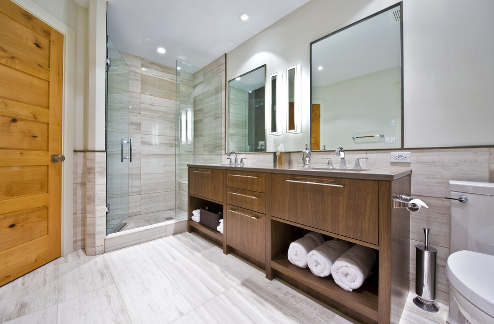 Contemporary bathroom in Calgary with flat-panel cabinets, dark wood cabinets and an alcove shower.