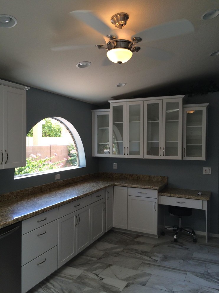 Large transitional l-shaped porcelain tile and gray floor kitchen photo in Phoenix with a double-bowl sink, shaker cabinets, white cabinets, granite countertops, stainless steel appliances and no island