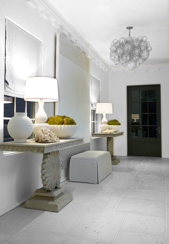 Inspiration for a mid-sized contemporary hallway in Miami with white walls and concrete floors.
