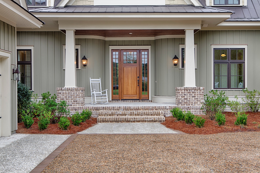 Large traditional two-storey green exterior in Charleston with concrete fiberboard siding.