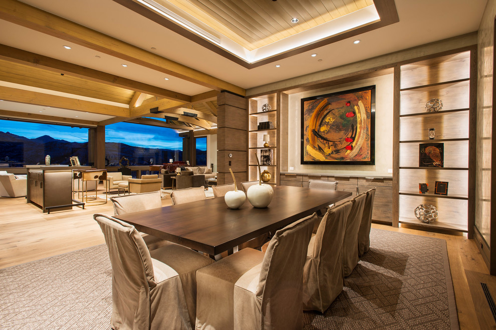 Photo of an expansive contemporary open plan dining in Denver with beige walls, light hardwood floors, no fireplace and brown floor.