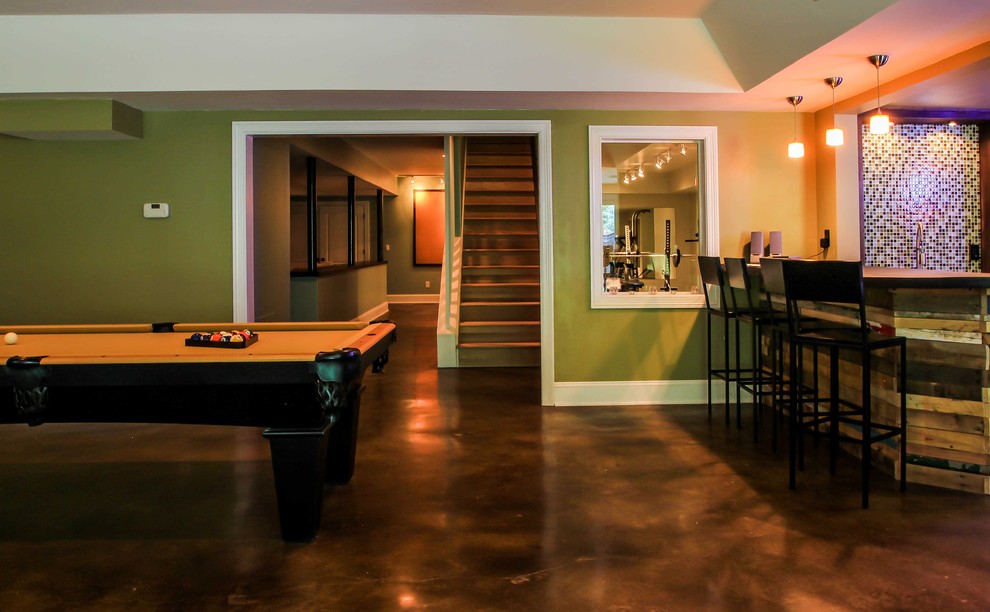 Inspiration for a contemporary basement in Atlanta with concrete floors and brown floor.