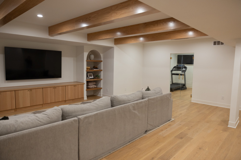 Modern Cozy Basement Remodel with Kings Buff Oak Flooring - Modern ...