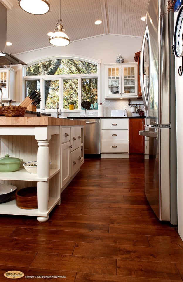 Transitional kitchen photo in Other with an undermount sink, white cabinets and an island