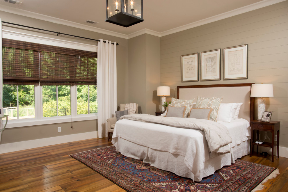 Inspiration for a mid-sized country master bedroom in Charleston with grey walls, medium hardwood floors, no fireplace and brown floor.