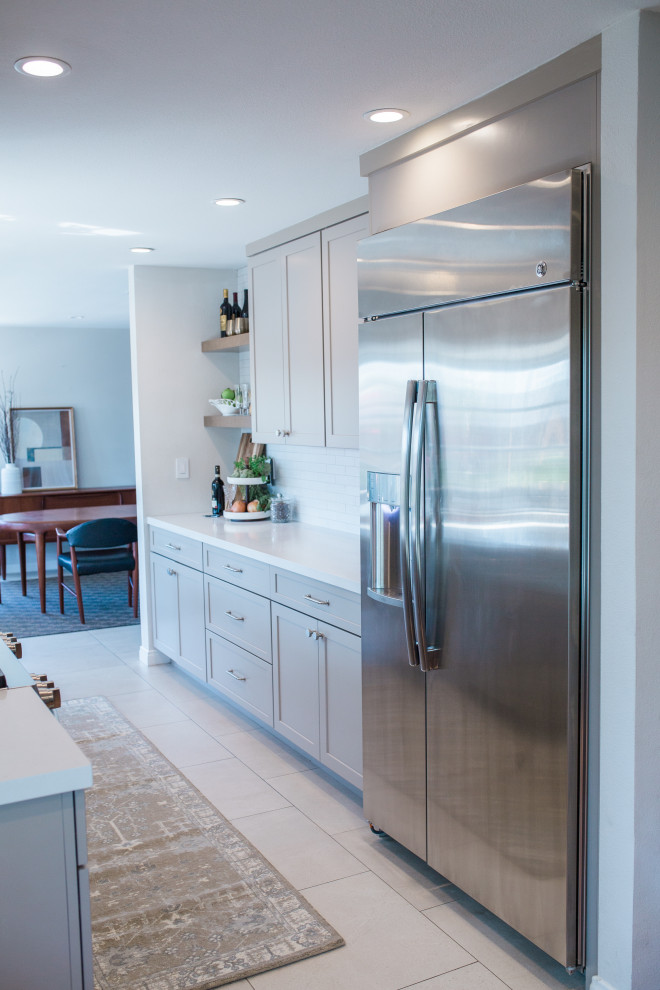 Small transitional galley porcelain tile and beige floor open concept kitchen photo in Orange County with a double-bowl sink, shaker cabinets, beige cabinets, quartz countertops, white backsplash, subway tile backsplash, stainless steel appliances, no island and white countertops