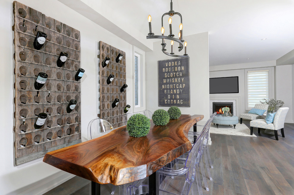 Photo of a transitional dining room in Toronto with grey walls and medium hardwood floors.